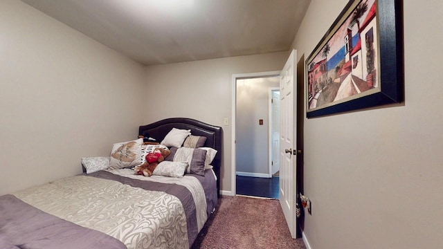 bedroom featuring baseboards and carpet floors