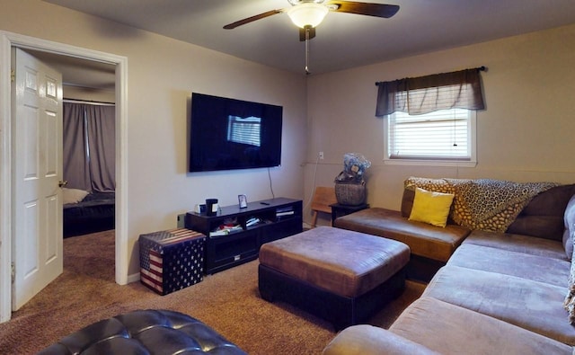 living room featuring carpet flooring and a ceiling fan