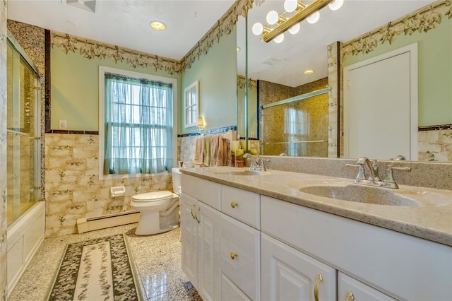 bathroom with toilet, a baseboard radiator, a sink, and tile walls