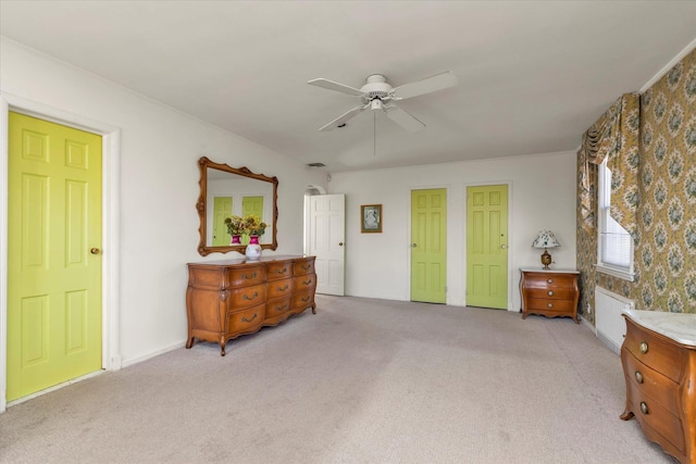 bedroom with ceiling fan, visible vents, and light carpet