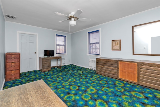 office area featuring visible vents, dark carpet, crown molding, and radiator heating unit