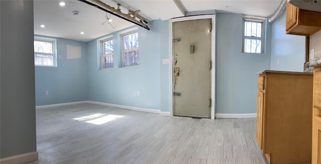 interior space featuring recessed lighting, baseboards, and light wood-type flooring