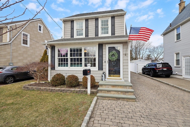 view of front of property with decorative driveway