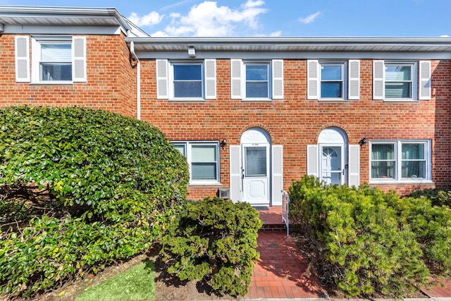 view of front of house featuring brick siding