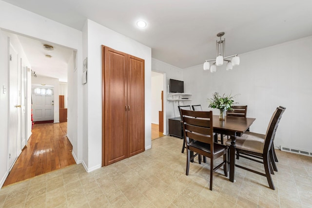 dining room featuring baseboards and visible vents