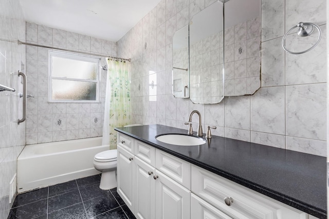 bathroom featuring vanity, shower / bath combo with shower curtain, tile walls, toilet, and tile patterned floors