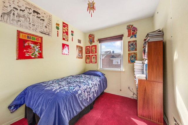 carpeted bedroom with baseboards