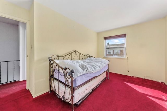 carpeted bedroom with baseboards