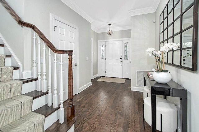 foyer with stairway, baseboards, dark wood finished floors, and crown molding