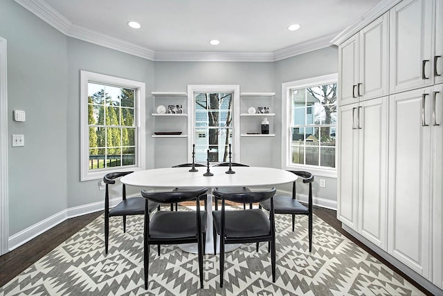 dining room featuring crown molding, recessed lighting, wood finished floors, and baseboards