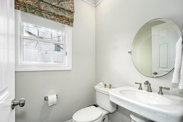 bathroom featuring toilet and a sink