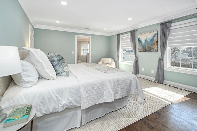 bedroom with wood finished floors, visible vents, baseboards, recessed lighting, and ornamental molding