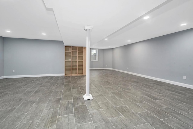 basement with wood finished floors, recessed lighting, and baseboards