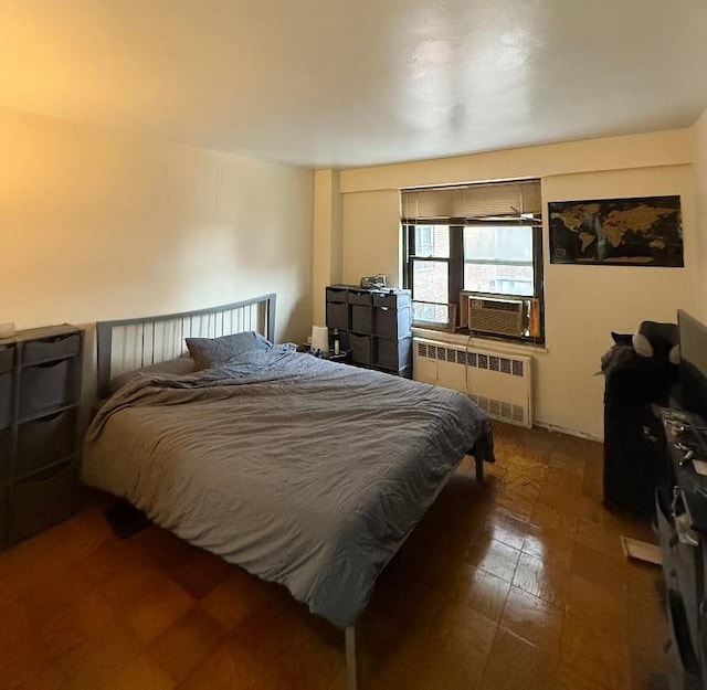 bedroom with cooling unit and radiator heating unit