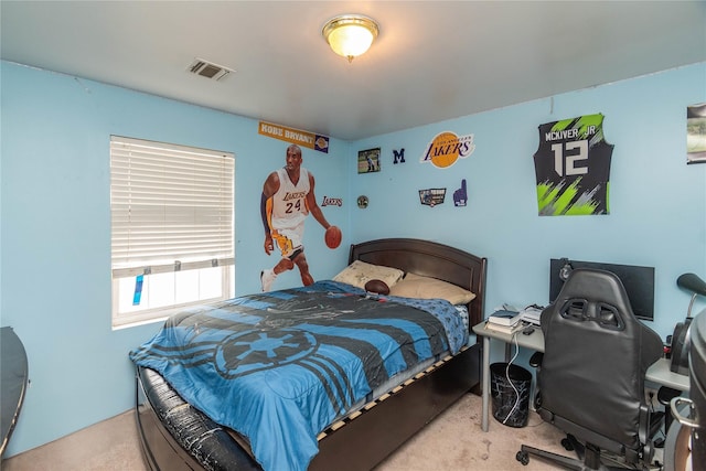 carpeted bedroom featuring visible vents