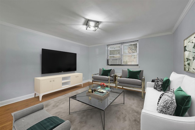 living room with crown molding, cooling unit, wood finished floors, and baseboards