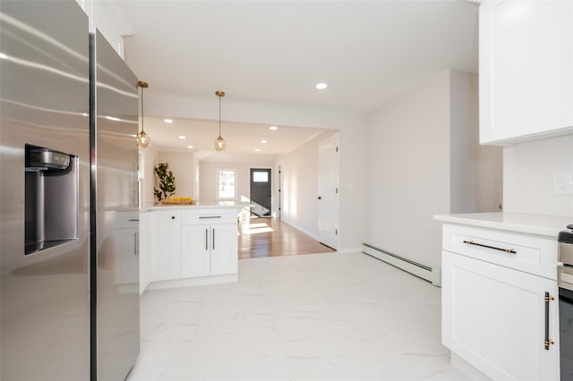 kitchen with recessed lighting, baseboard heating, stainless steel fridge, and white cabinets