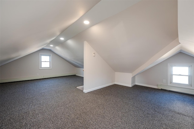 bonus room featuring baseboards, carpet floors, baseboard heating, and vaulted ceiling