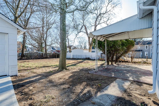 view of yard featuring a patio and fence