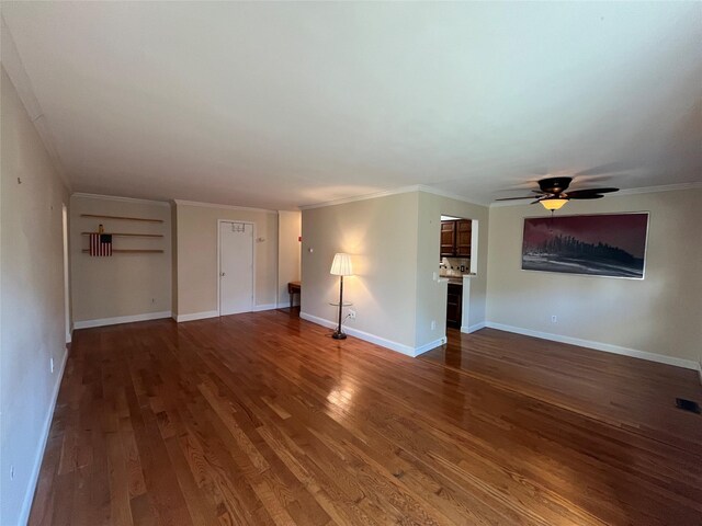 27 Sycamore Dr Bldg 2A, Middletown, NY 10940 - unfurnished living room featuring ornamental molding, a ceiling fan, baseboards, and wood finished floors