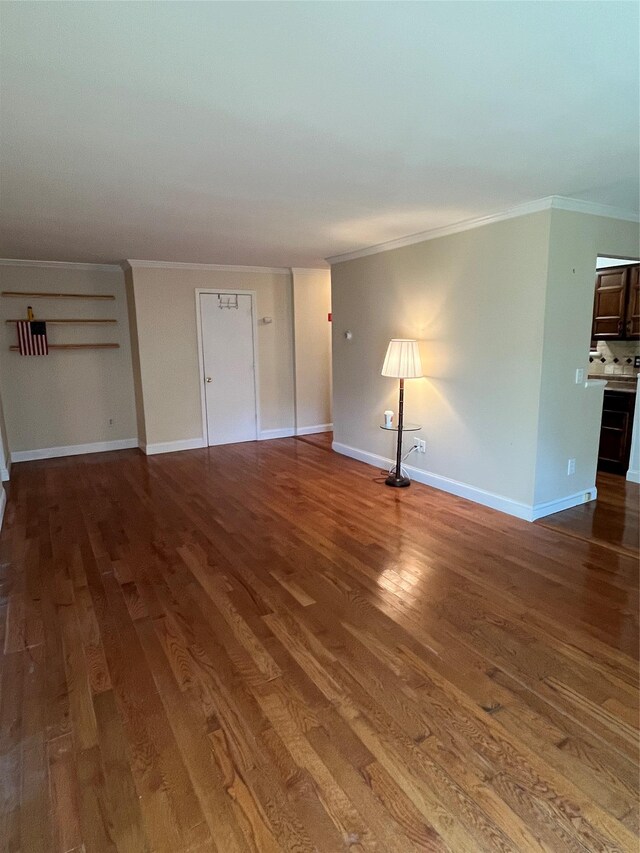 27 Sycamore Dr Bldg 2A, Middletown, NY 10940 - unfurnished living room featuring crown molding and wood finished floors