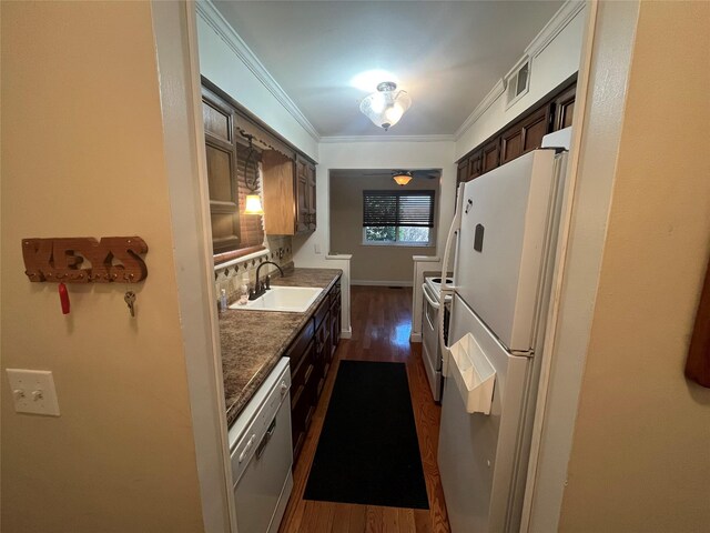 27 Sycamore Dr Bldg 2A, Middletown, NY 10940 - kitchen with visible vents, ornamental molding, a sink, dark wood-style floors, and white appliances