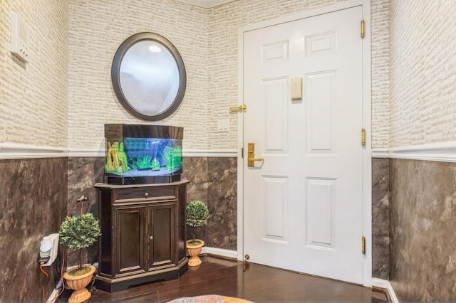 foyer featuring wood finished floors