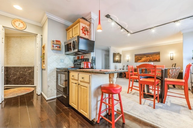 kitchen featuring black range with electric stovetop, light brown cabinets, stainless steel microwave, dark wood finished floors, and crown molding