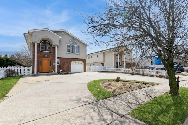 view of front of house featuring brick siding, stucco siding, fence, a garage, and driveway