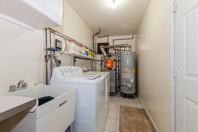 clothes washing area with gas water heater, light tile patterned flooring, a sink, independent washer and dryer, and cabinet space