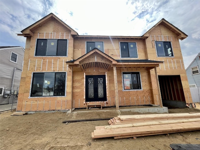 view of front facade with french doors and fence