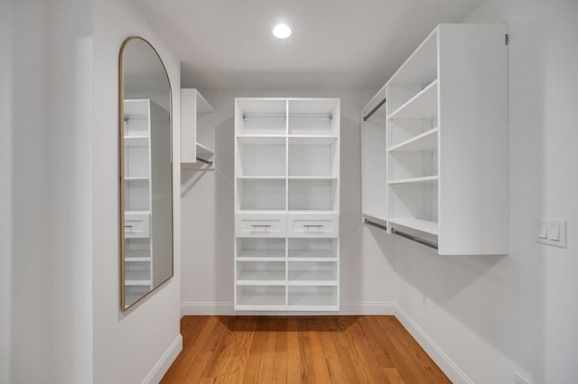 spacious closet with wood finished floors