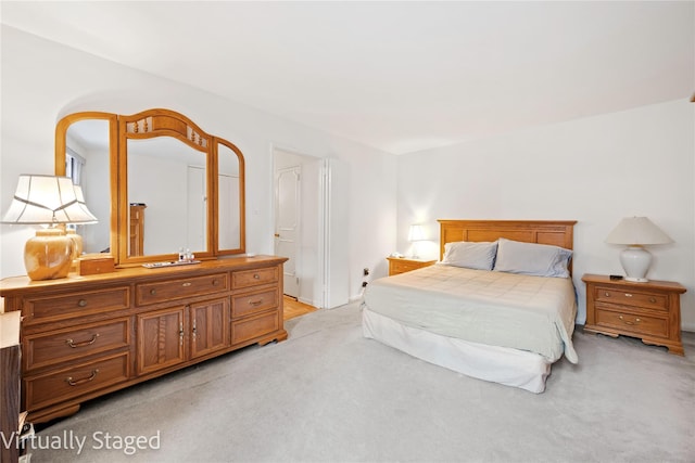 bedroom with light colored carpet