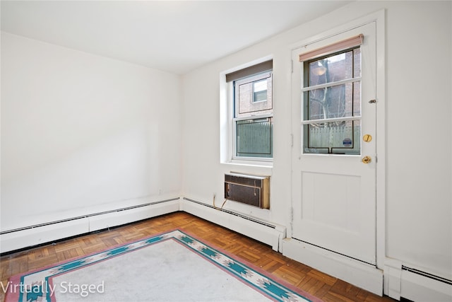 doorway featuring baseboard heating and an AC wall unit