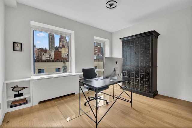 office area with light wood-style floors