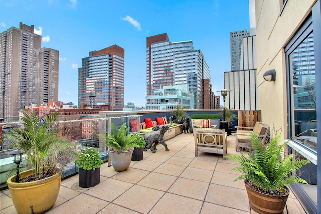 view of patio / terrace featuring a city view