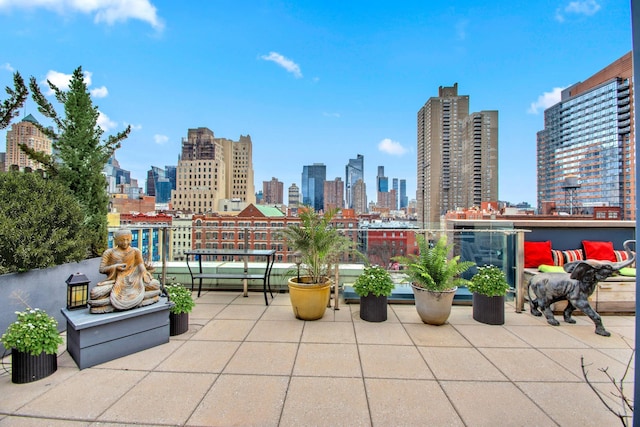 view of patio with a city view and a balcony