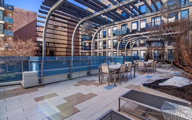 view of patio / terrace with outdoor dining space and a pergola