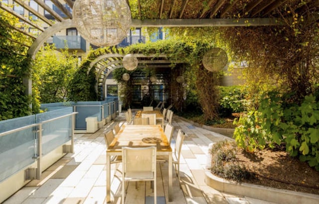 view of patio / terrace featuring outdoor dining area and a pergola