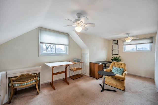 living area with lofted ceiling, baseboards, a wealth of natural light, and carpet floors