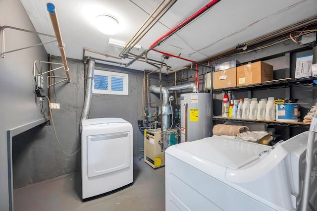 basement with gas water heater and separate washer and dryer