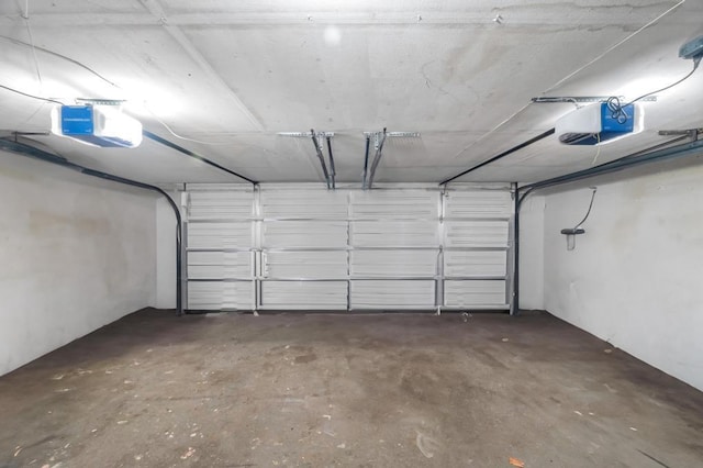 parking garage featuring a garage door opener