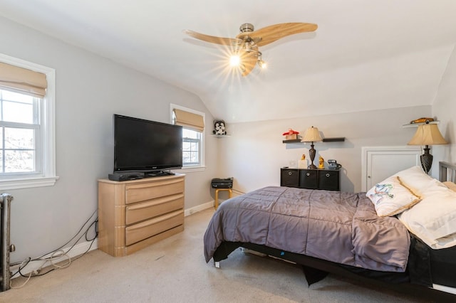 bedroom with baseboards, carpet, ceiling fan, and vaulted ceiling