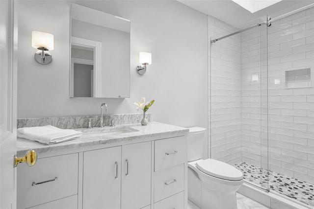 bathroom with marble finish floor, a stall shower, vanity, and toilet