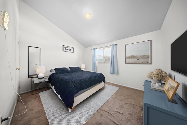 bedroom with carpet, baseboards, and vaulted ceiling