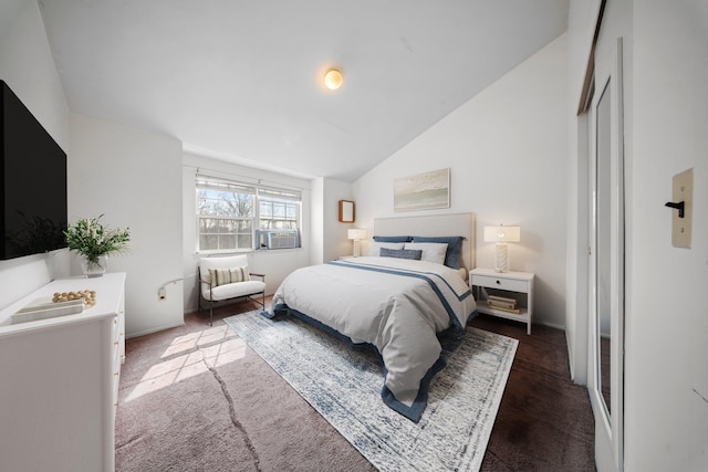 bedroom with vaulted ceiling and cooling unit