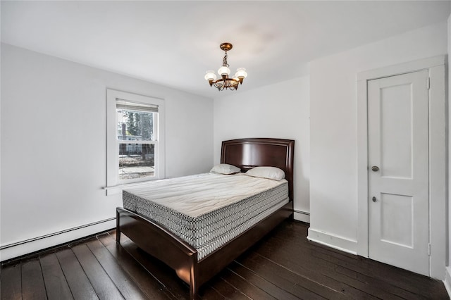 bedroom featuring a chandelier, dark wood-style flooring, baseboard heating, and a baseboard radiator