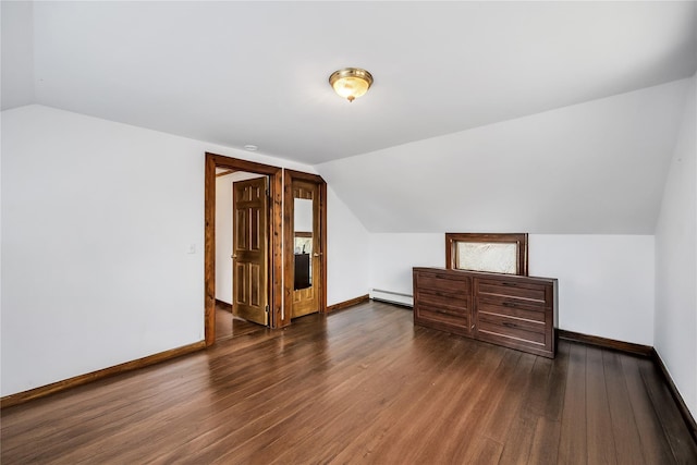 bonus room featuring baseboard heating, wood finished floors, and baseboards