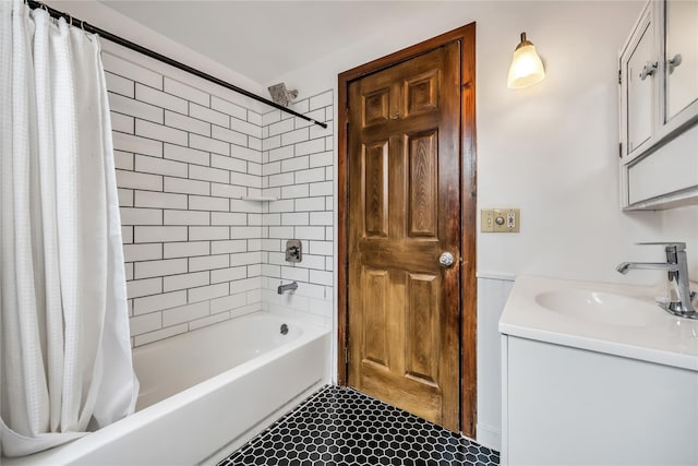 bathroom with shower / tub combo and vanity