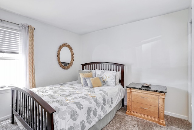 bedroom with carpet and baseboards